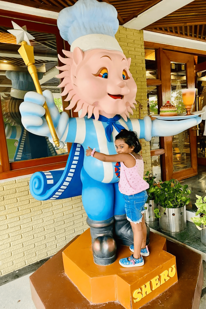 Charismatic Sheru iconic of Ramoji Film City with a child enjoying the moment